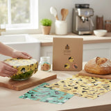SuperBee Australia beeswax wrap set with cat patterns covering a bowl in a bright, eco-friendly kitchen setting.