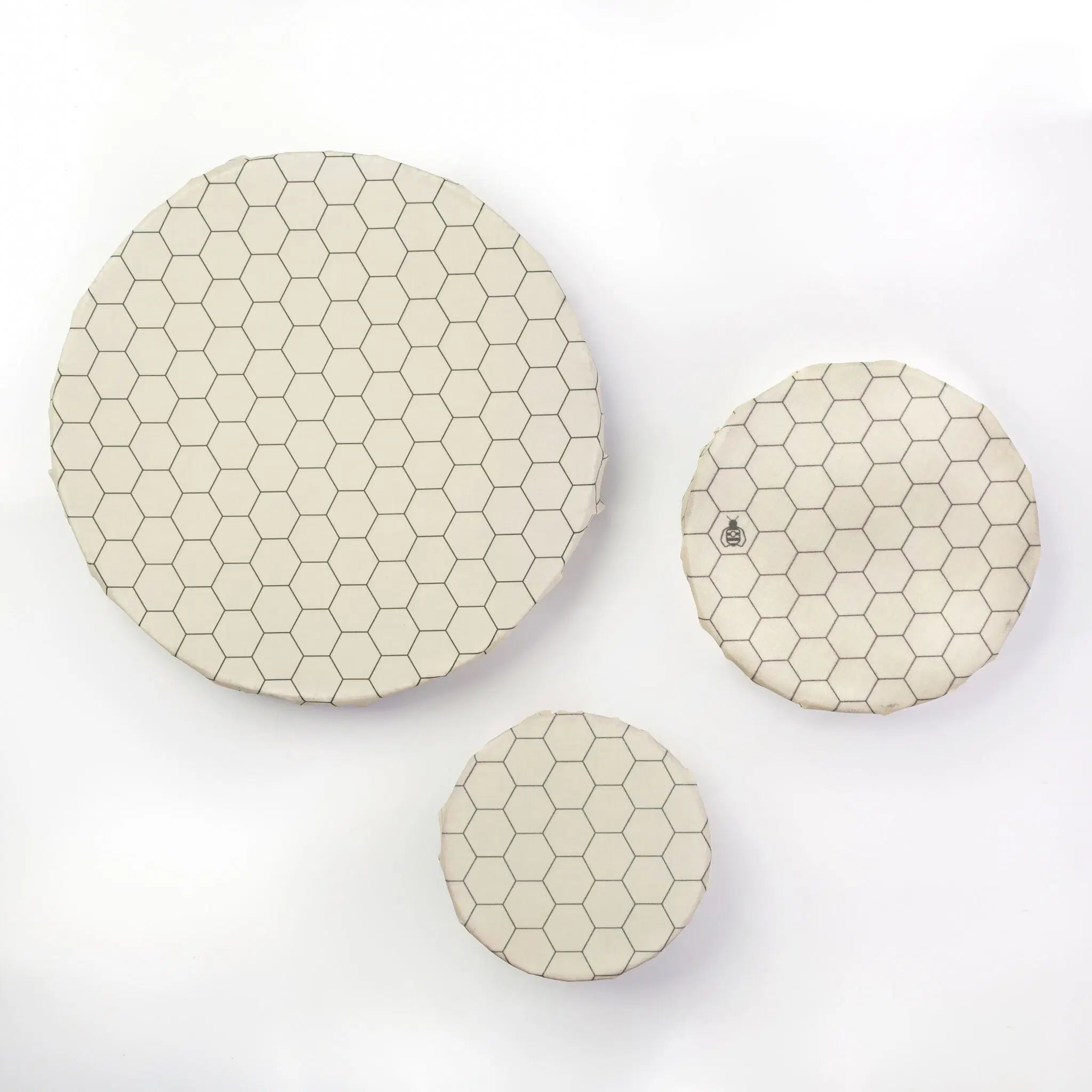 SuperBee Australia beeswax wrap Beeginner Set in a cream hexagon pattern, three circular reusable food covers.