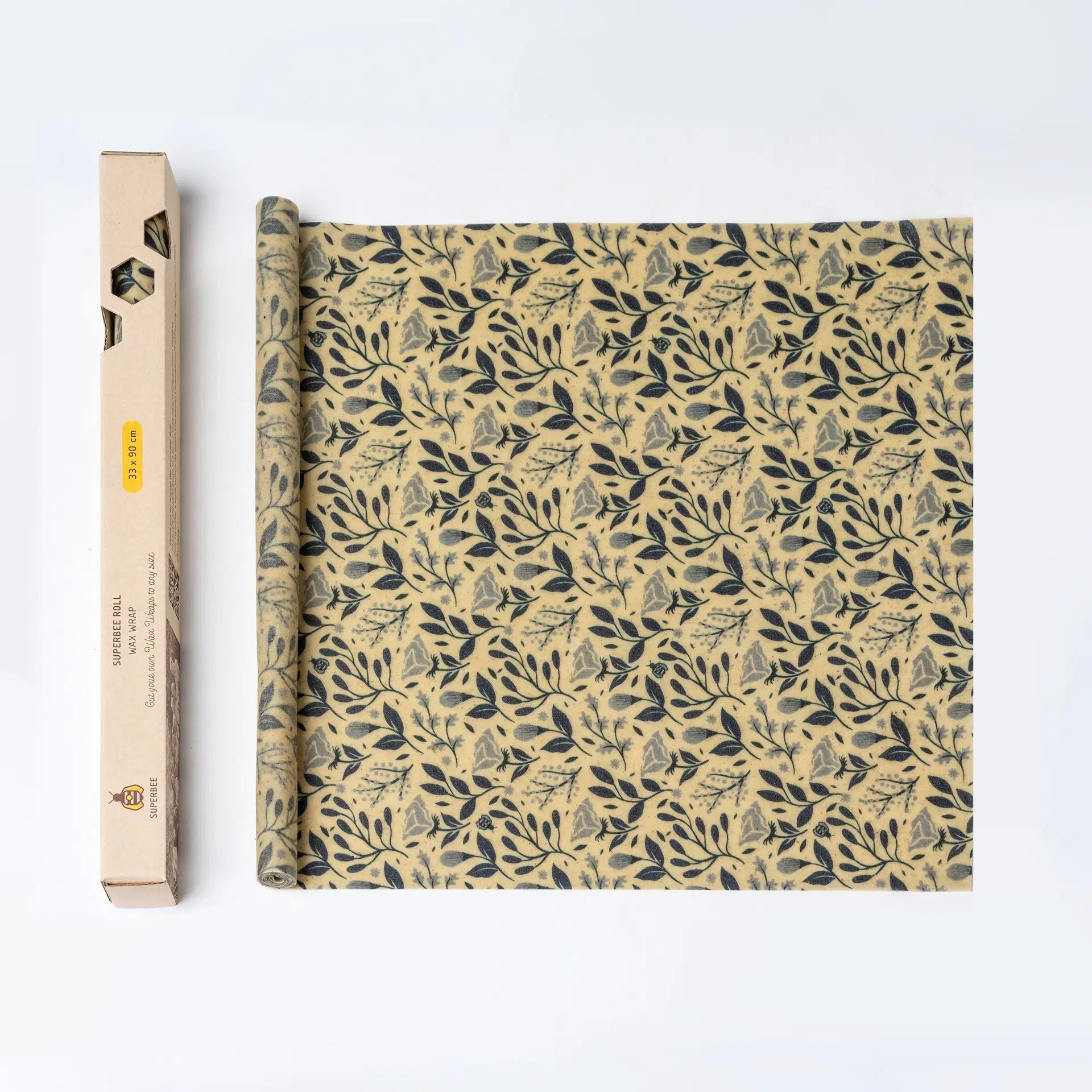 SuperBee Australia beeswax wrap roll with a petite flower pattern in dark blue on a natural yellow background.