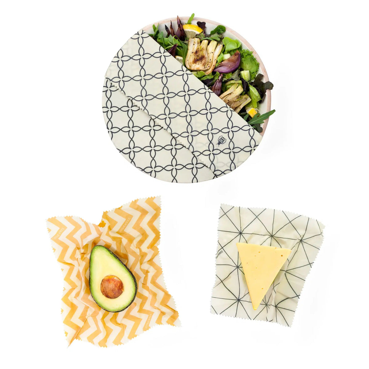 SuperBee Australia beeswax wrap set covering a salad bowl, half an avocado, and a wedge of cheese on white background.
