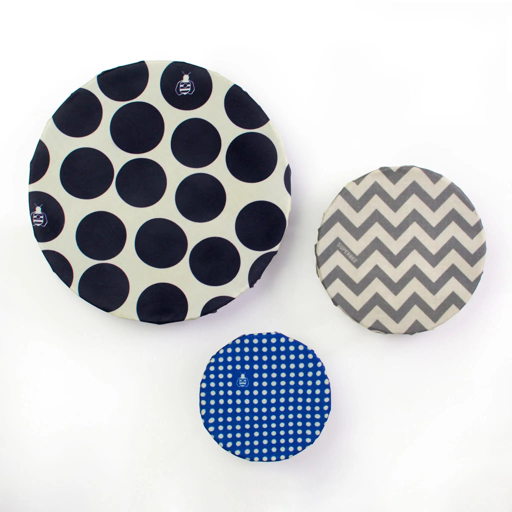 SuperBee Australia Beeginner Set of three round beeswax wraps in black polka dot, grey chevron, and blue dot patterns.