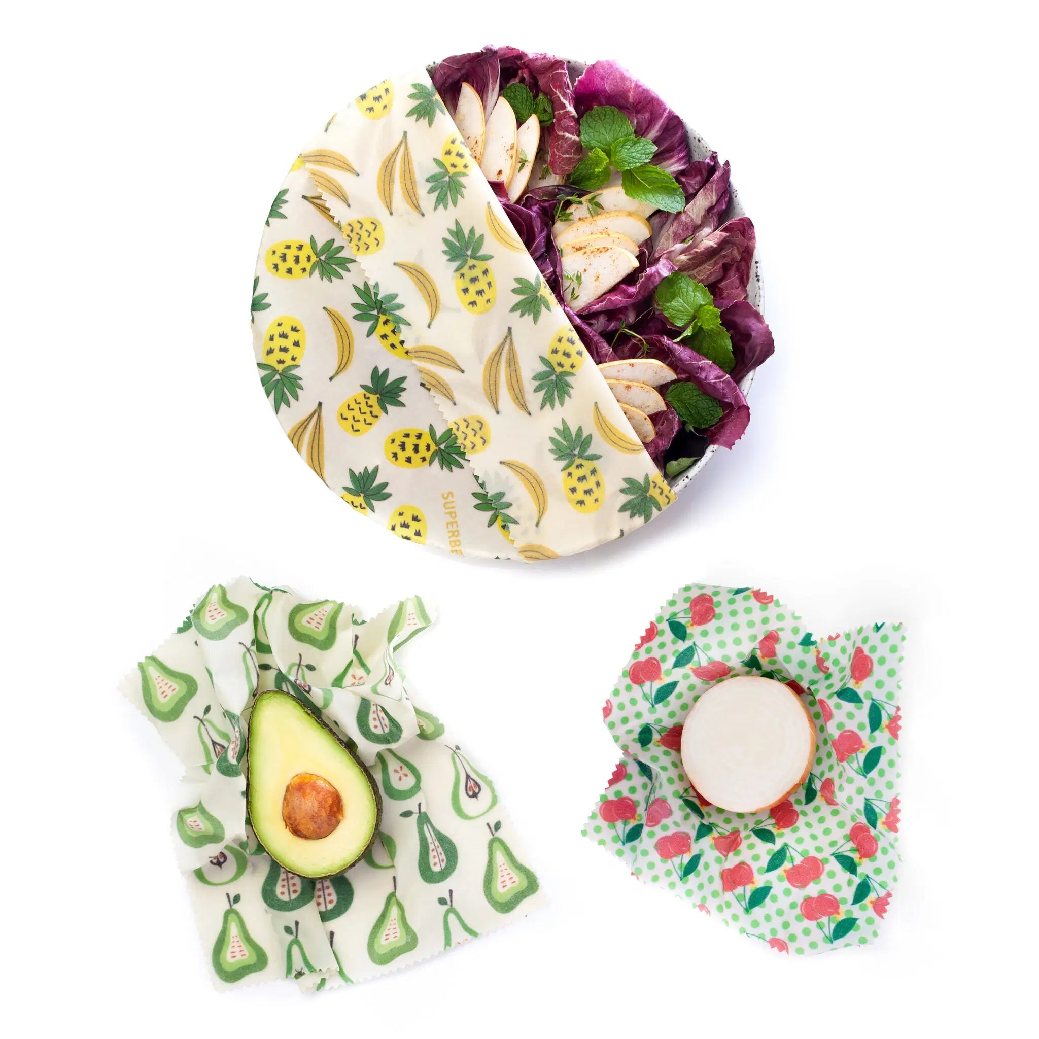 SuperBee Australia Beeginner beeswax wrap set with pineapple, pear, and cherry prints covering food on a white background