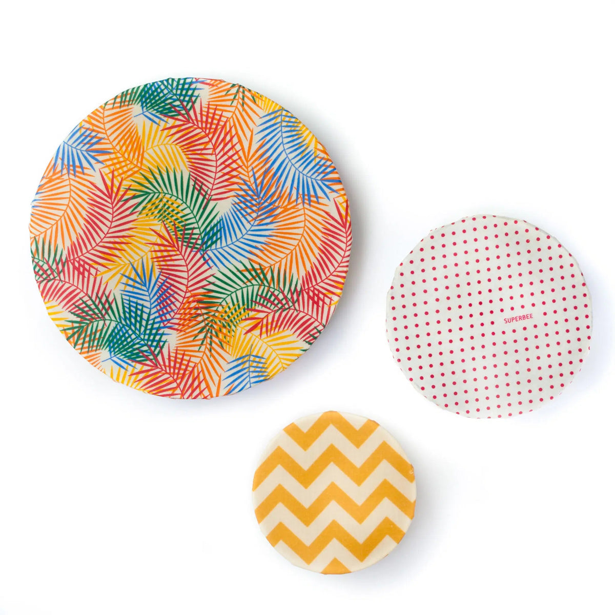SuperBee Australia beeswax wrap set featuring tropical palm leaf, red polka dot, and yellow chevron patterns.