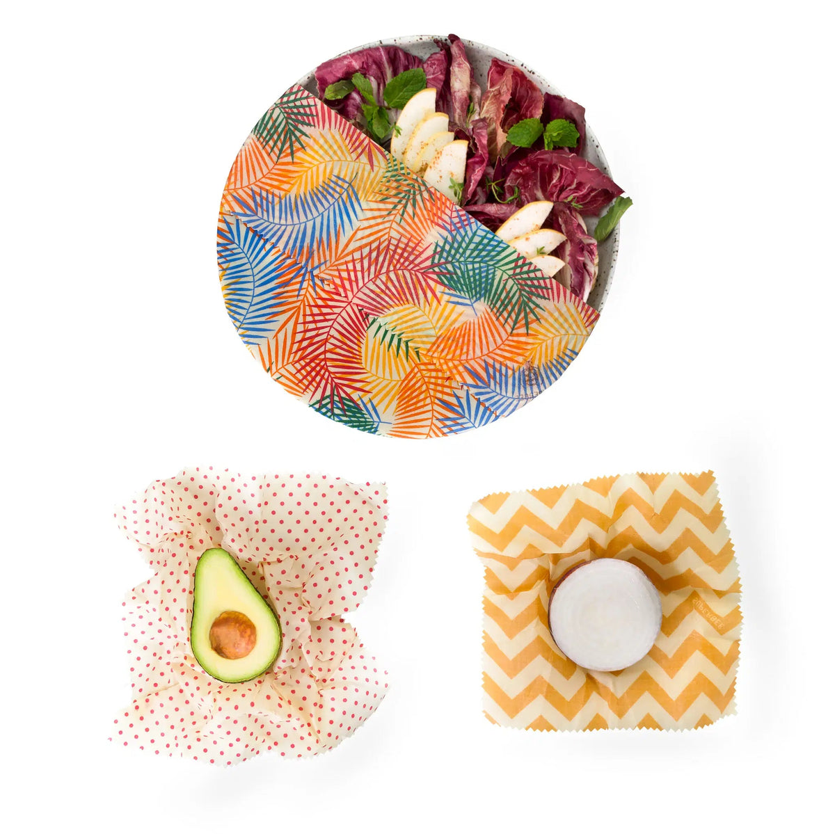 SuperBee Australia beeswax wrap set featuring tropical leaf, red polka dot, and yellow chevron patterns on food items.