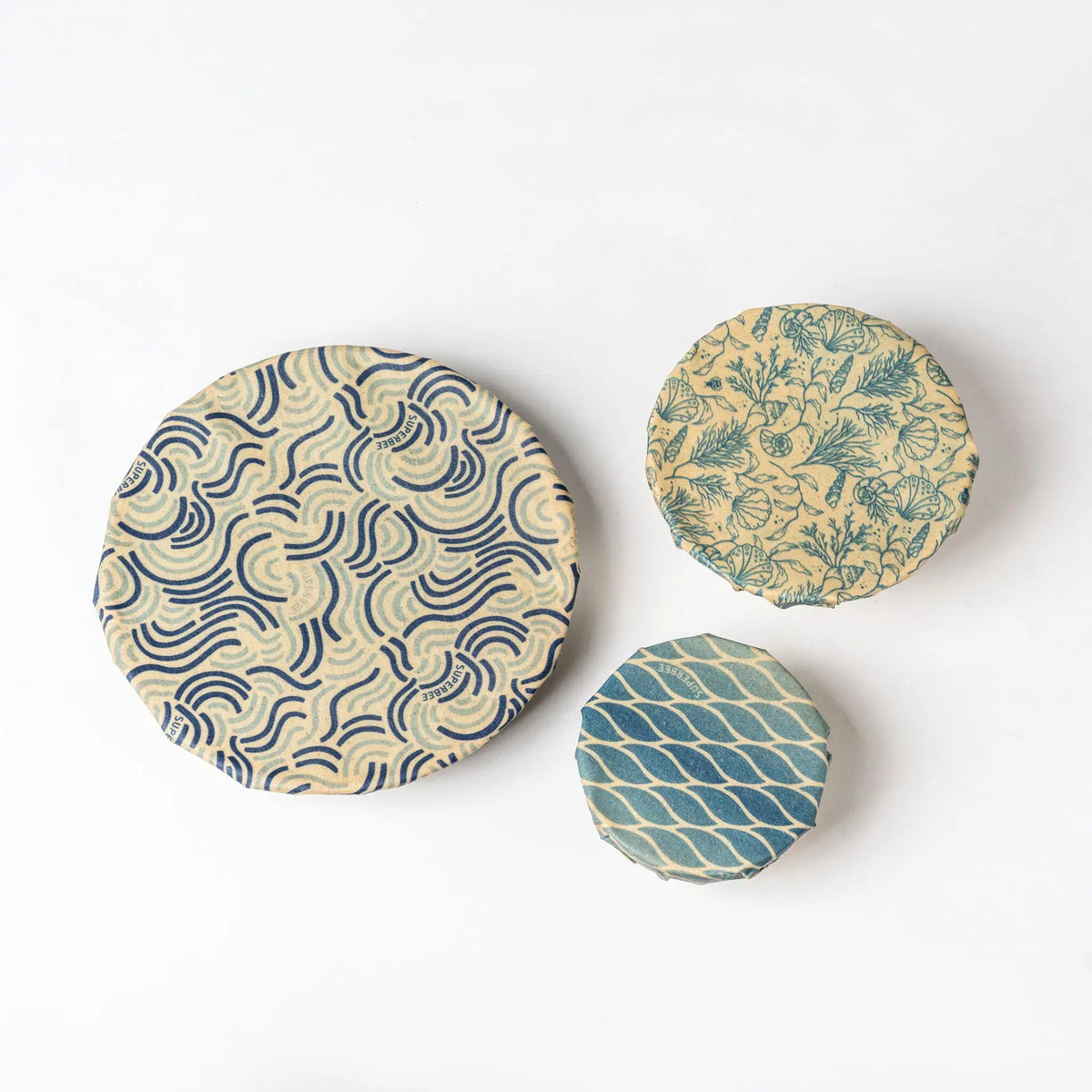 SuperBee Australia beeswax wrap Beeginner set in Ocean Action print with three circular wraps in blue and beige
