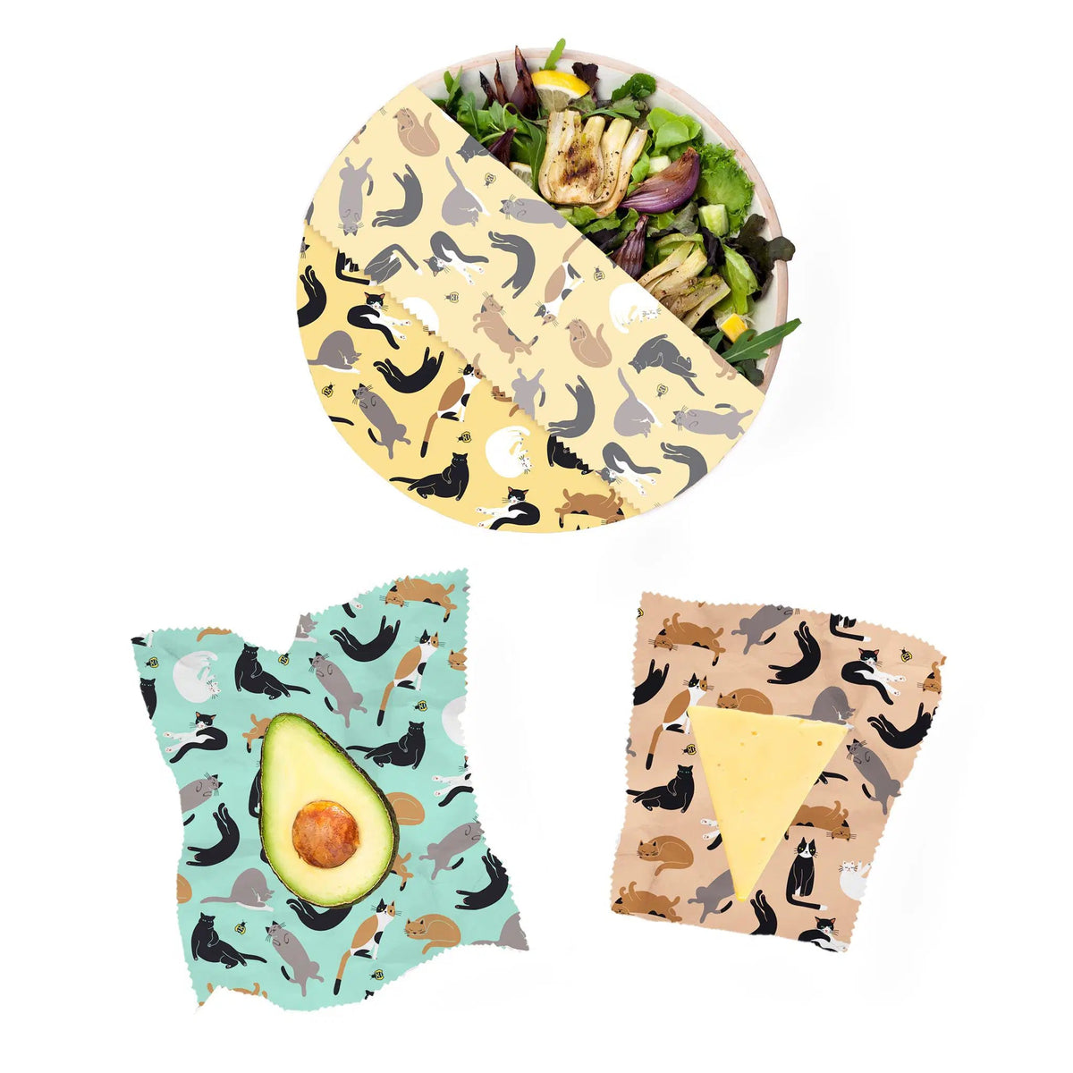 SuperBee Australia beeswax wrap set featuring cat patterns, covering a salad bowl, avocado, and cheese wedge.