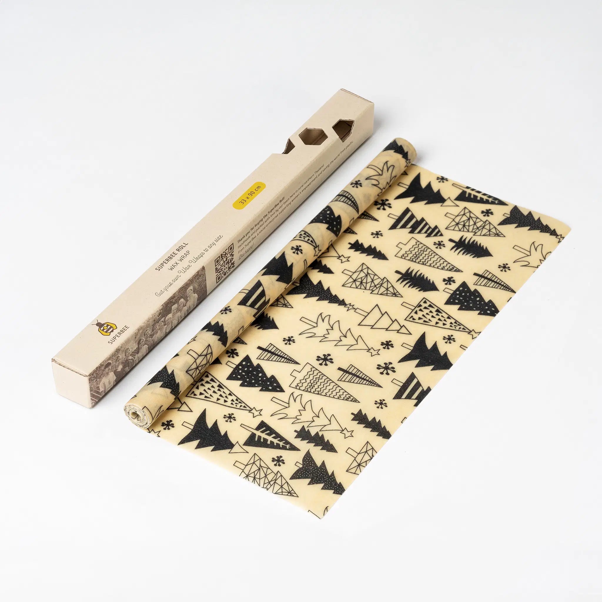 SuperBee Australia beeswax wrap roll featuring a black and white Christmas tree pattern on natural fabric