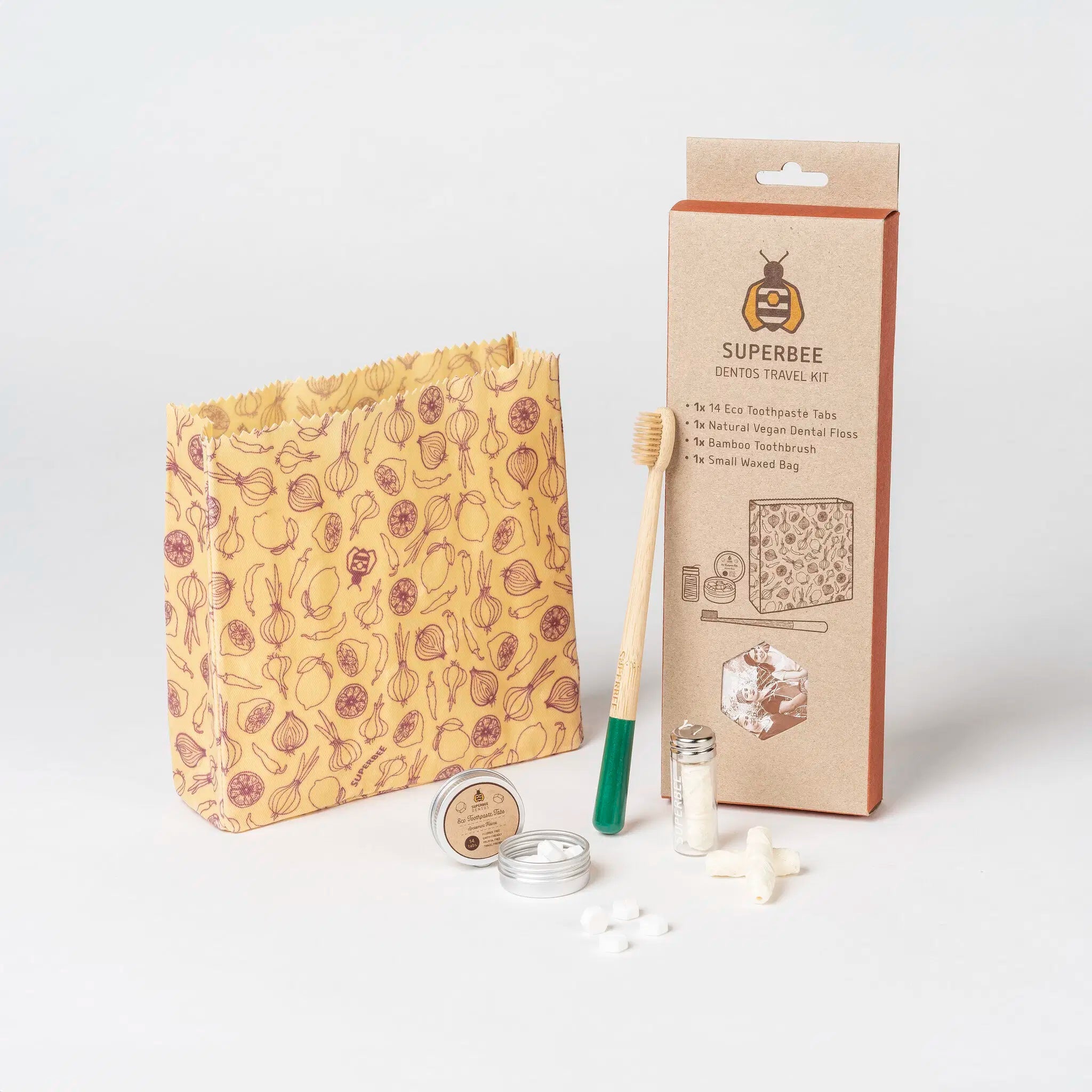 SuperBee Australia Dentos dental travel kit with bamboo toothbrush, toothpaste tabs, and beeswax bag on white surface