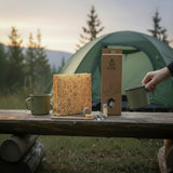 SuperBee Australia Dentos dental travel kit with beeswax bag, bamboo toothbrush, and oral care in a camping setting.