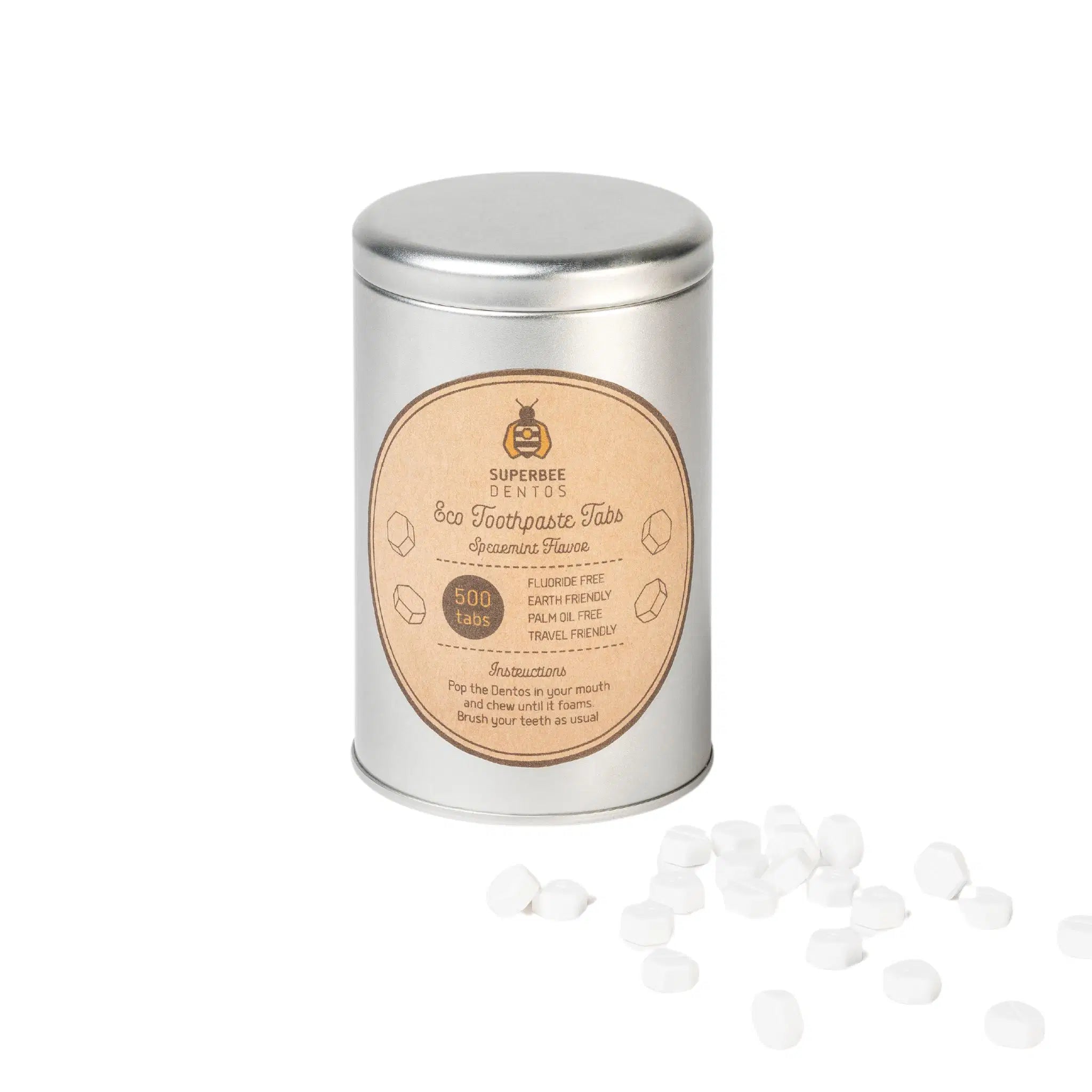 SuperBee Australia Dentos spearmint toothpaste tablets in a reusable metal tin with scattered white tablets