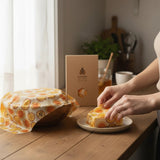 SuperBee Australia extra large reusable beeswax wrap with passion fruit print covering a bowl and wrapping food