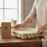 SuperBee Australia extra large organic beeswax wrap covering a baking dish on a wooden kitchen table