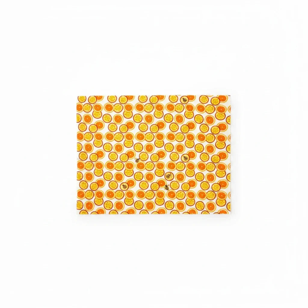 SuperBee Australia extra large reusable beeswax wrap featuring a vibrant orange passion fruit pattern on white cotton.