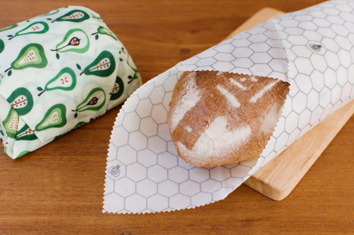 SuperBee Australia extra large reusable beeswax wrap with white hexagon pattern wrapped around a loaf of bread