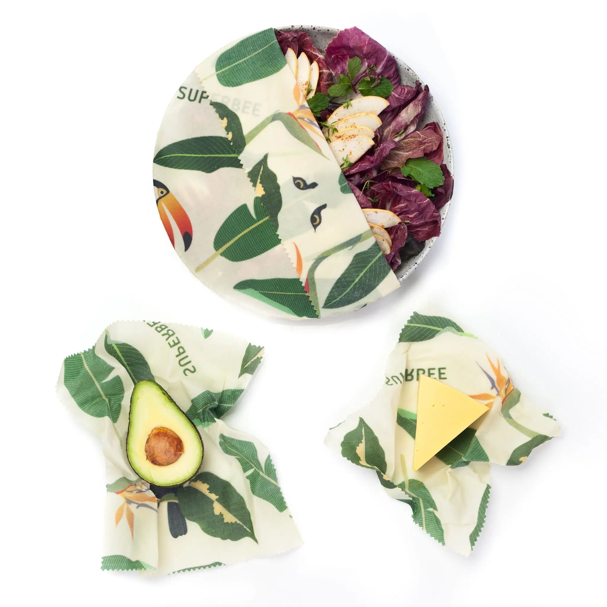 SuperBee Australia Beeginner Set beeswax wraps in Jungle print covering a salad bowl, avocado, and cheese wedge.
