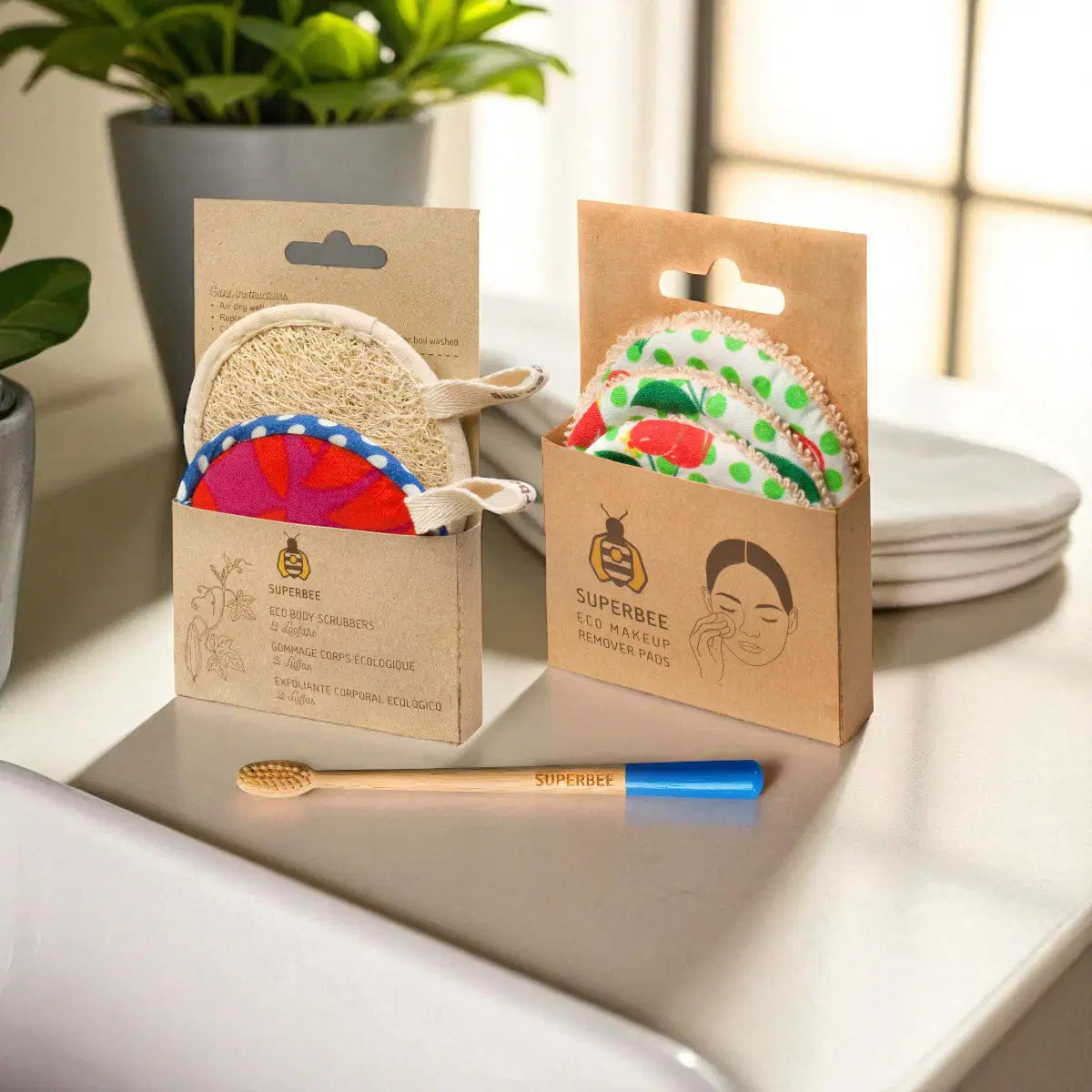 SuperBee Australia plastic-free bathroom starter kit with loofahs, reusable makeup pads, and a bamboo toothbrush.
