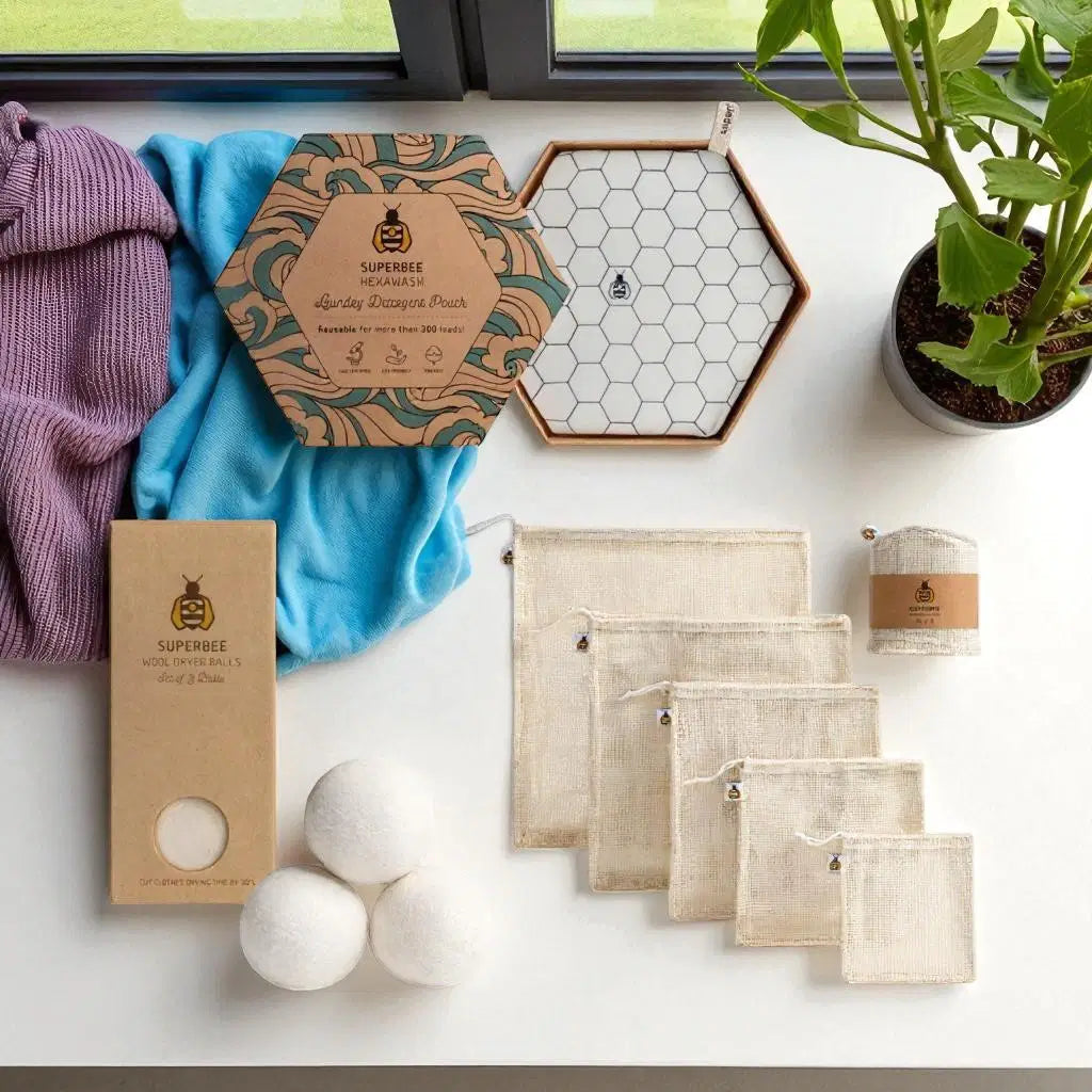 SuperBee Australia plastic-free laundry starter kit with wool dryer balls, magnesium pouch, and mesh bags.