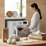 SuperBee Australia plastic-free laundry starter kit with wool dryer balls, mesh bags, and magnesium pouch on a table.
