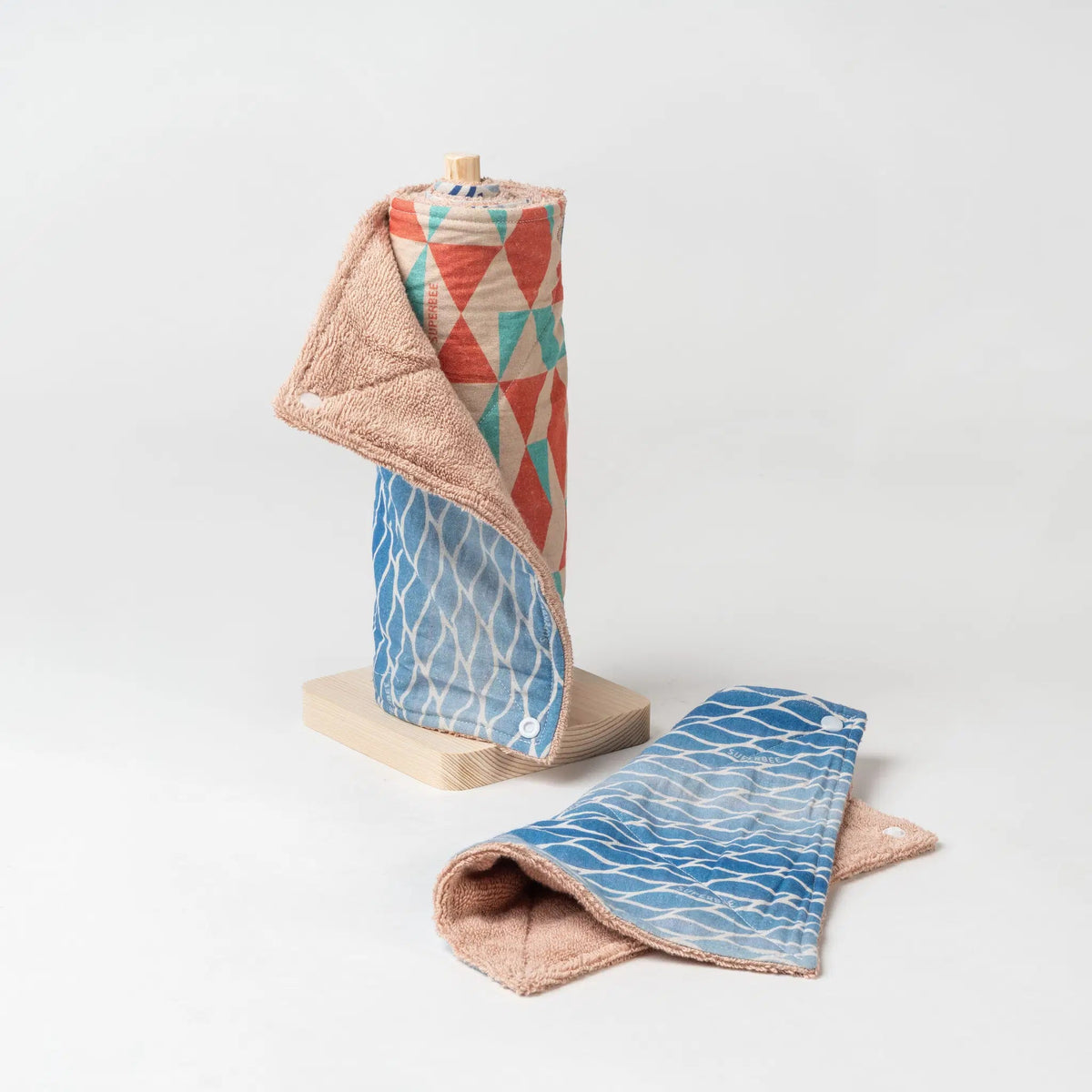 SuperBee Australia reusable organic cotton paper towel roll in Blue Lagoon pattern with absorbent towelling texture