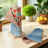 SuperBee Australia reusable organic cotton paper towel roll in Blue Lagoon pattern with absorbent brown towelling