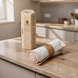 SuperBee Australia reusable organic cotton paper towel roll with white hexagonal pattern on a wooden kitchen counter