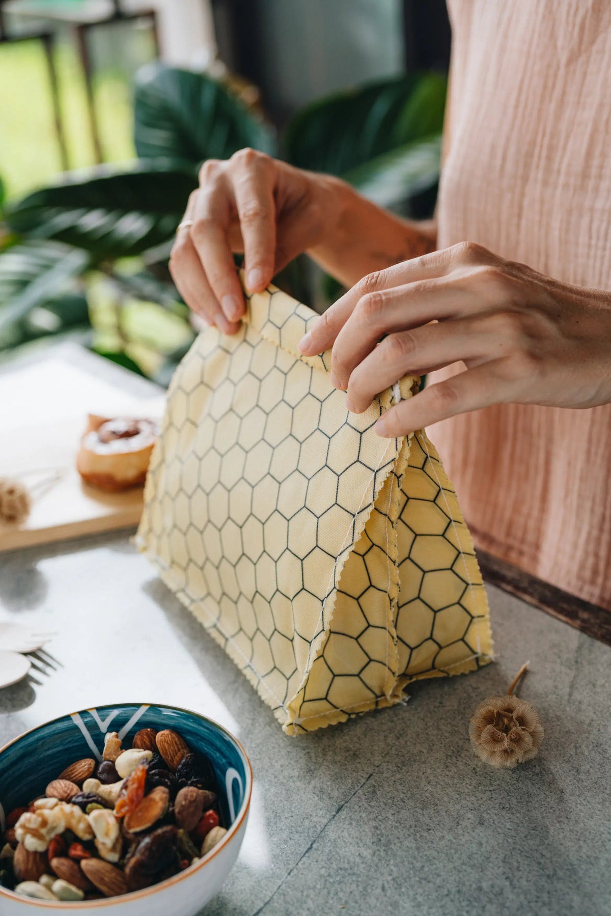 SuperBee Australia zero-waste kitchen kit featuring a yellow honeycomb-patterned reusable wax food bag on a counter.