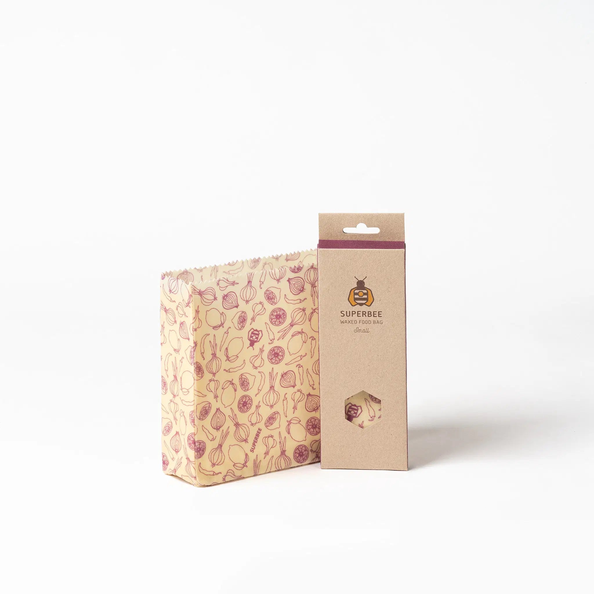 SuperBee Australia small beeswax food storage bag with spicy vegetable print next to its eco-friendly packaging