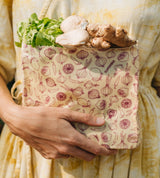 SuperBee Australia small reusable beeswax food bag with spicy vegetable print holding fresh produce