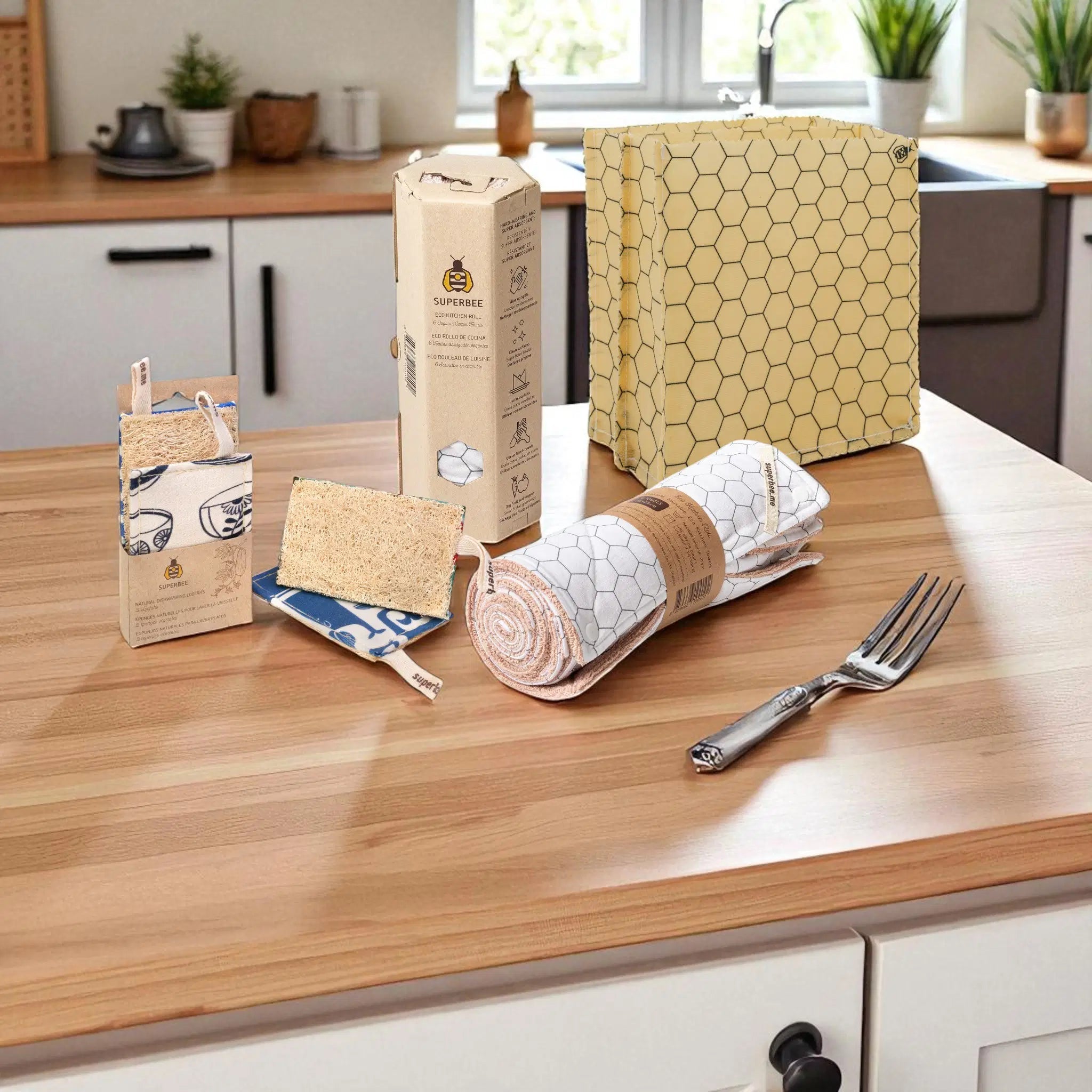 SuperBee Australia zero-waste kitchen starter kit with reusable wax bag, natural loofahs, and paperless towel roll.