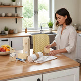 SuperBee Australia Kitchen Swap Box with reusable wax bag, natural loofahs, and washable paper towels on a kitchen counter